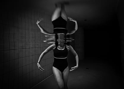 grayscale photography of woman in water thumbnail