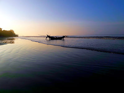 boat by the beach under sunset thumbnail