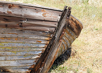 brown wooden boat on green grass thumbnail