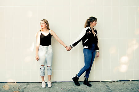 Two Women Standing Against Wall thumbnail