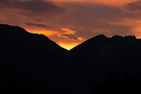 silhouette photography of mountains during golden time thumbnail