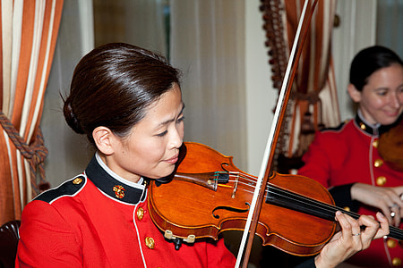 woman playing brown and black violin thumbnail