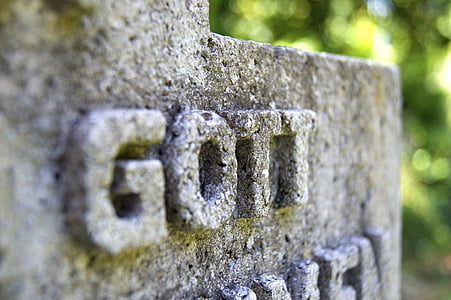 gott text embossed concrete surface thumbnail