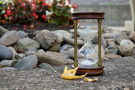 hourglass near yellow autumn leaf thumbnail
