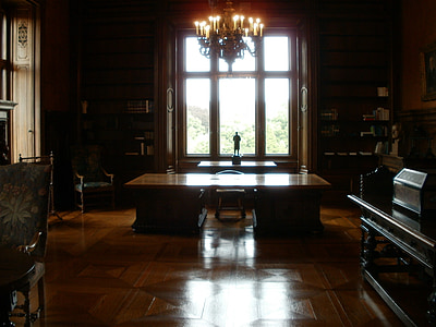 brown wooden desk inside on brown painted room thumbnail