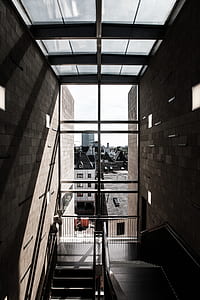 window view of concrete building during daytime thumbnail