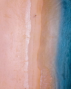 person walking on the beach thumbnail