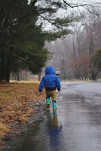 toddler in blue hooded jacket walking on the road thumbnail