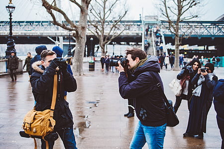 four person capturing each other at daytime thumbnail