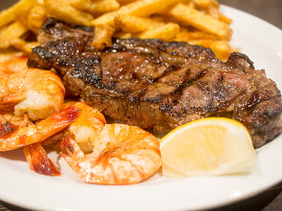 meat steak and shrimps in white ceramic plate thumbnail