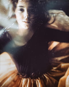 photo of girl wearing black and brown dress thumbnail