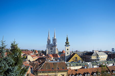 white cathedral near buildings thumbnail
