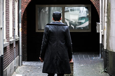 man standing on alley thumbnail