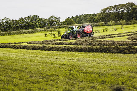 green tractor on grass field thumbnail