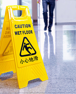 yellow caution wet floor sign on floor thumbnail