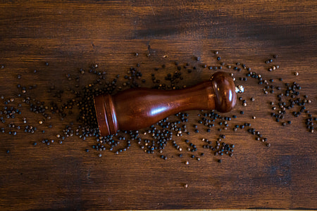 brown pepper mill on brown surface thumbnail