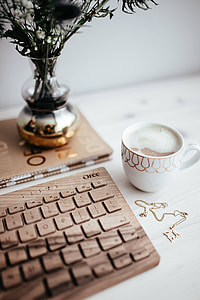 Wooden keyboard and cup of coffee thumbnail