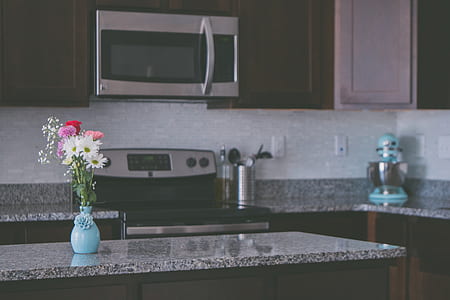 silver wall-mount microwave oven over electric smooth top range thumbnail