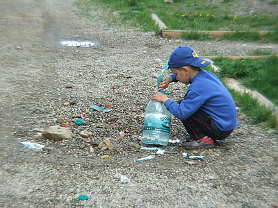 boy holding plastic bottle thumbnail