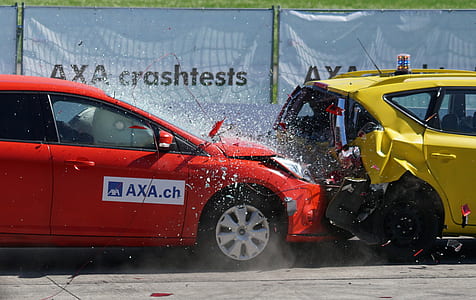time lapse photography of red car crashed on yellow hatchback thumbnail