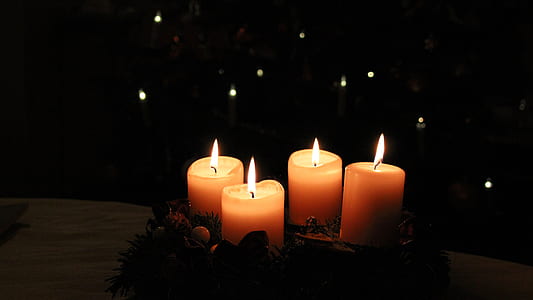 four lightened pillar candles thumbnail