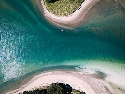 aerial view photography of body of water between two island thumbnail