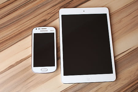 white Samsung Galaxy Android smartphone and white iPad thumbnail