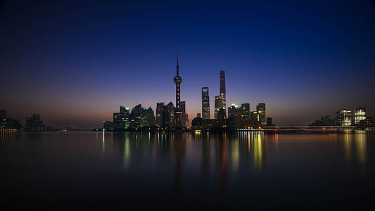 city buildings near body ofwater thumbnail