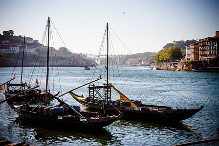 three black sailing ships at dock thumbnail