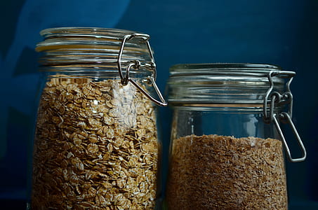 close up photo of two clear canister jars thumbnail