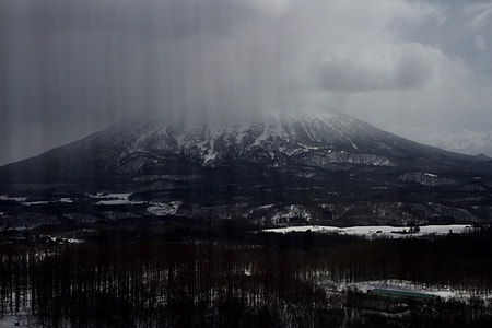 black rocky mountain covered white snow thumbnail