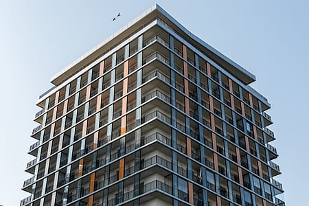 low angle photo of brown high-rise building thumbnail