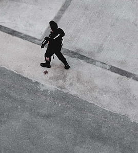 Police walking at street with rifle thumbnail