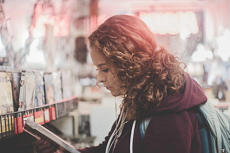 blonde woman reading book outdoors thumbnail