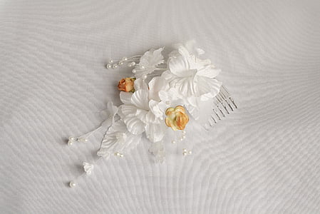 white flower French comb on white textile thumbnail