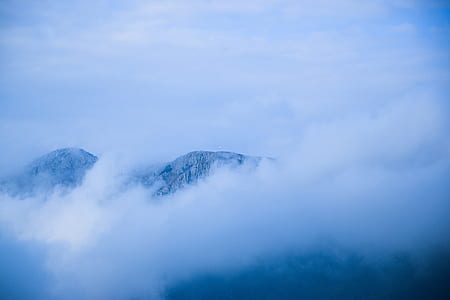 fog and snow-covered mountain aerial photo thumbnail