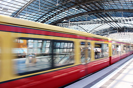 red and white train passing by station thumbnail