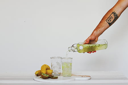 person pouring juice on cup thumbnail
