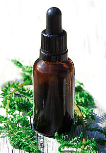 brown and black labeled bottle with green leaves thumbnail