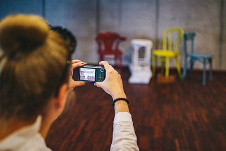 People with cameras at an exhibition thumbnail