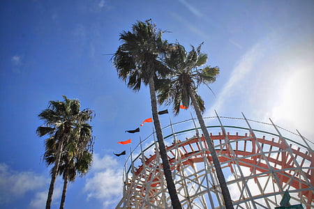 white and orange roller coaster at daytime thumbnail
