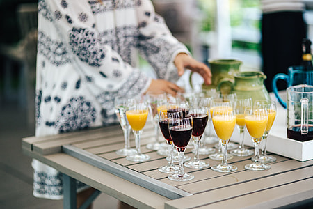 Glasses with wine and orange juice thumbnail