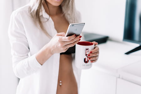 Woman Working on iPhone from Home thumbnail