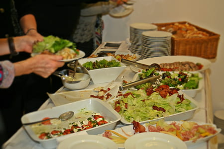 person serving vegetable salad thumbnail