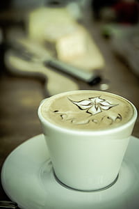 selective focus photography of white cup on saucer thumbnail