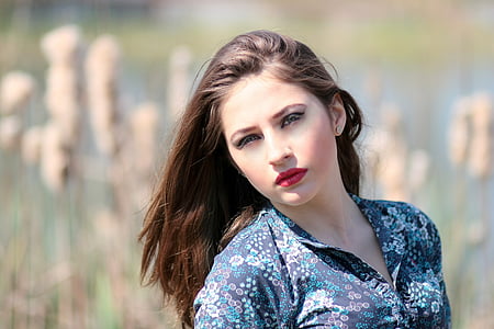 woman wearing blue and white floral collard top thumbnail
