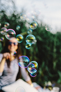 Having fun with soap bubbles in the nature thumbnail