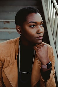 woman wearing brown leather jacket thumbnail