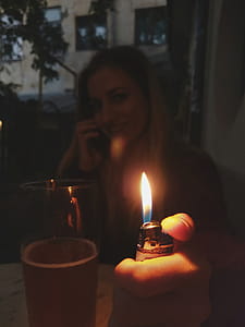 Woman Holding Lit Lighter thumbnail