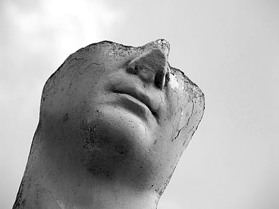 grayscale photo of beheaded statue thumbnail